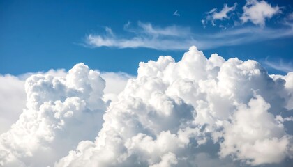Fluffy cumulus clouds against a vibrant blue sky (1)