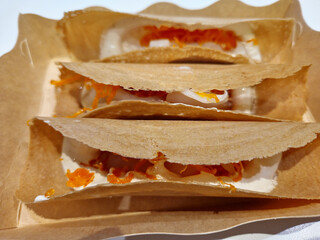 Khanom Buang, also known as Thai Crispy Pancakes or Thai Crepes. Close-Up.