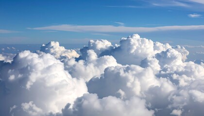 Fluffy white clouds against a vibrant blue sky