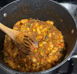 Homemade One-Pot Stew with Pasta, Vegetables, and Ground Beef in Sauce on Stovetop