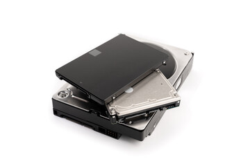 Pile of a variety of computer Hard disk drive HDD and SSD isolated on white background. Computer...