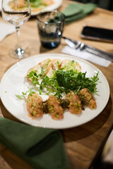 Serving salmon tartare with avocado