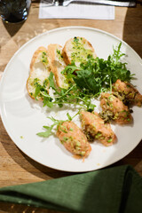 Serving salmon tartare with avocado
