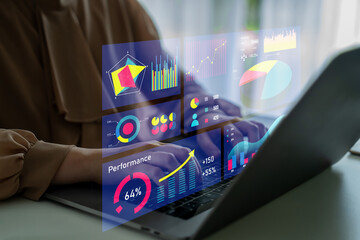 A professional setup featuring a laptop with a digital analytics dashboard displaying various charts and graphs for performance analysis and metrics visualization. Impute