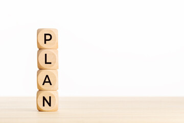 Plan concept. Wooden block with text on table