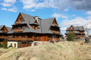 ZAKOPANE, POLAND - APRIL 04, 2025: Traditional houses in mountain city Zakopane, Poland.
