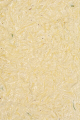 A detailed, top-down view of raw potato scarpaccia batter, showcasing the texture of grated potatoes in a creamy mixture ready to be baked