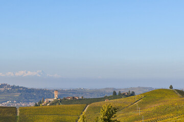 A view of the Langhe vineyard hills, Unesco World Heritage Site, with the old village of Barbaresco in autumn, Cuneo province, Piedmont, Italy
