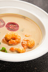 Tom kha soup shrimp, coconut milk, miso paste tasty seafood snack fresh delicious gourmet food background on the table rustic food top view copy space pescetarian diet