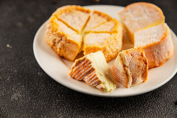 Cheese plate camembert, brie, munster french cheese tasty snack fresh delicious gourmet food...