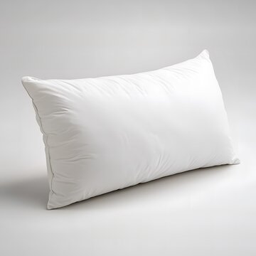 soft, inviting pillow promises restful nights. It's a symbol of comfort and relaxation, creating a serene visual of sleep and home life.