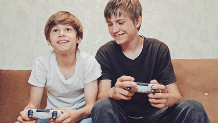 Young Gamer: Teen Boys Immersed in Console Gaming, Boys playing games, Cinematic Shot of Sofa...