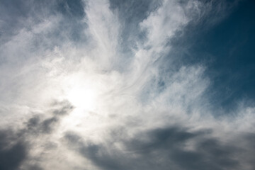 A blue sky with dramatic clouds creates a powerful and visually striking scene, full of contrast and atmosphere