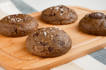 chocolate chip cookies on a wooden board 