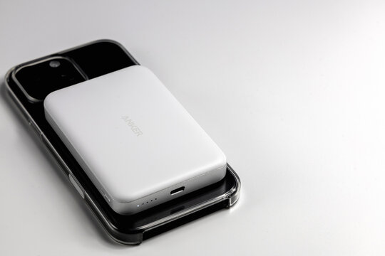 Closeup iPhone charging using magnetic powerbank device