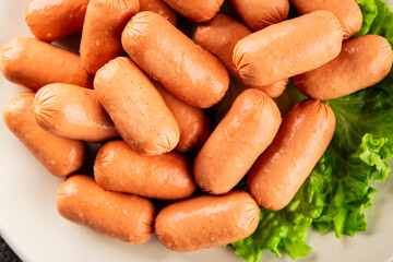 Mini sausages fresh delicious processed meat tasty snack fresh delicious gourmet food background on the table rustic food top view copy space