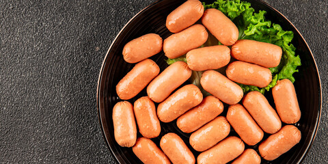 Mini sausages fresh delicious processed meat tasty snack fresh delicious gourmet food background on the table rustic food top view copy space