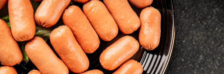 Mini sausages fresh delicious processed meat tasty snack fresh delicious gourmet food background on the table rustic food top view copy space