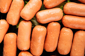 Mini sausages fresh delicious processed meat tasty snack fresh delicious gourmet food background on the table rustic food top view copy space