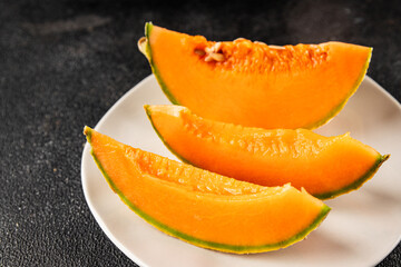 Melon Charente ripe sweet fruit tasty snack fresh delicious gourmet food background on the table rustic top view copy space keto and paleo diet vegan and vegetarian food