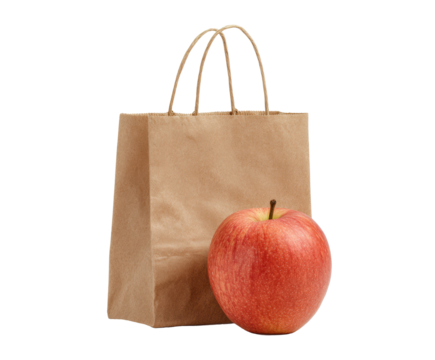 Fresh apple and paper bag for grocery shopping on a transparent background, cut out