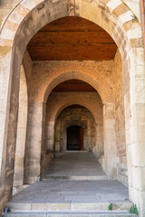 Medieval Stone Arches and Passageway Illuminated by Sunlight