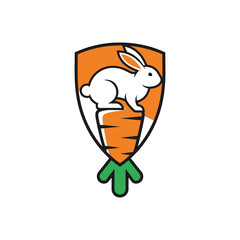 Cute white rabbit sitting on a large carrot inside a shield emblem logo.