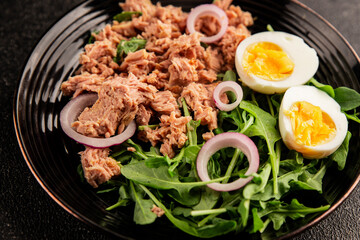 Tuna salad egg, arugula, vegetables tasty snack fresh delicious gourmet food background on the table rustic food top view copy space keto and paleo diet food pescetarian diet