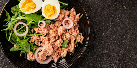Tuna salad egg, arugula, vegetables tasty snack fresh delicious gourmet food background on the table rustic food top view copy space keto and paleo diet food pescetarian diet