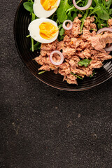 Tuna salad egg, arugula, vegetables tasty snack fresh delicious gourmet food background on the table rustic food top view copy space keto and paleo diet food pescetarian diet