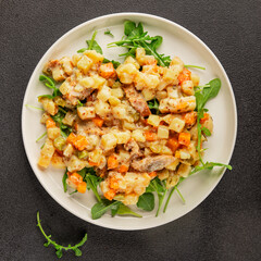 Potato salad with smoked fish tasty snack fresh delicious gourmet food background on the table rustic food top view copy space