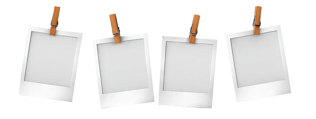 Four blank instant photo frames hanging
