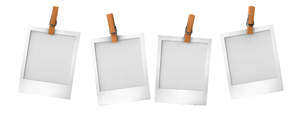 Four blank instant photo frames hanging