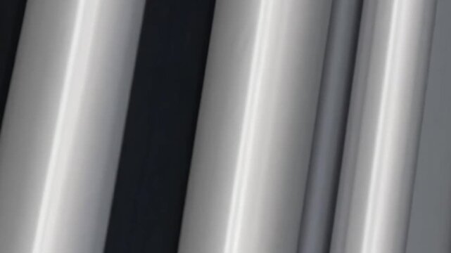 abstract metal tubes close up with reflective curves