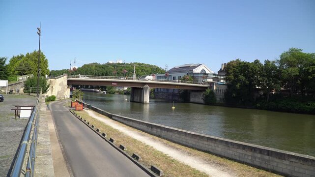 A road bridge spanning the river Oise in central Creil, France