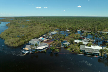 Aftermath of natural disaster. Surrounded by hurricane Ian rainfall flood waters homes in Florida...