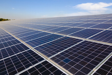 Office building with solar roof. Blue photovoltaic panels for producing clean ecological electric...