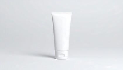 A blank, white tube-shaped cosmetic container stands on a neutral background, showcasing its clean lines and simple design.