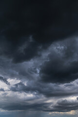 Epic Dramatic Storm sky with dark grey black cumulus rainy clouds abstract background texture, thunderstorm
