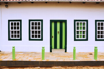 Colonial house door and windows in Corumbá de Goiás. This city was founded in 1730 by the...