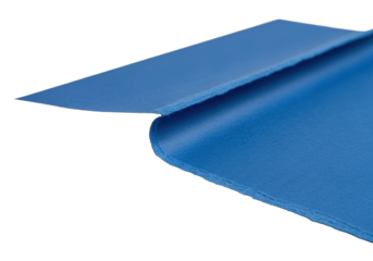 Deep sapphire blue, heavy textured cardstock with a sinuous torn edge revealing internal fibers, against a transparent background with copy space. Artistic transformation concept