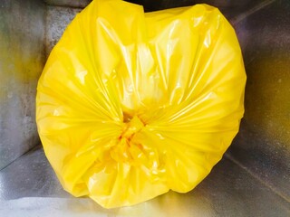 Infectious waste in biohazard plastic in an autoclave for sterilization