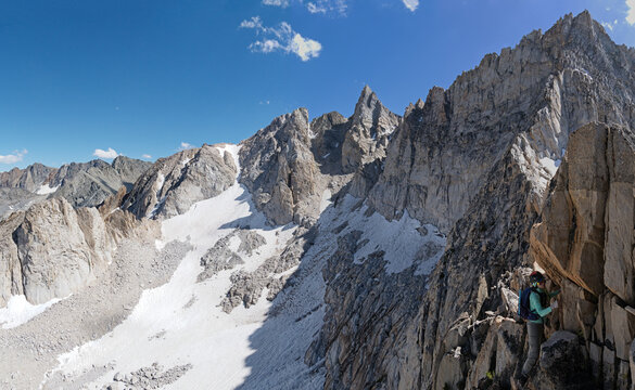 Woman Climbing Down The Northeast Ridge Of The Dragtooth - Powered by Adobe
