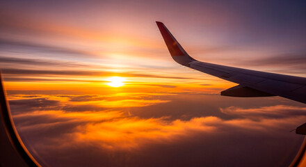 Fototapeta premium Sunrise Flight Through the Clouds, Aerial View from Plane Window