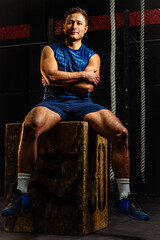 Athlete Latino man posing in the gym, ready for a workout routine, studio shot. Concept of...