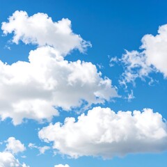 Obraz premium Fluffy white clouds against a vibrant blue sky (1)