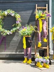 Beautiful floral decorations with flowers in trousers or pants on the wall