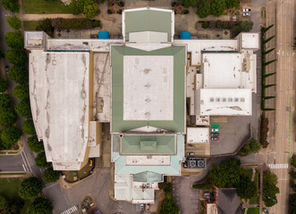 Daytime Drone Images of a Large Commercial Roof on a Performing Arts Center in Downtown Raleigh North Carolina on a Cloudy Day. The Roof Features TPO and Standing Seam Metal. 