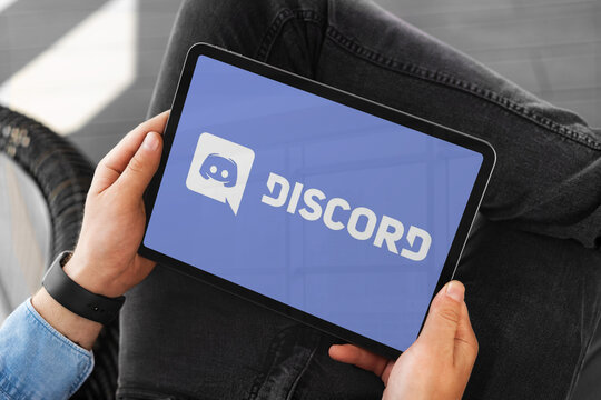 Man using discord app on tablet computer