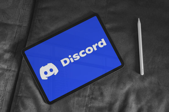 Discord social media app displaying on tablet screen with stylus